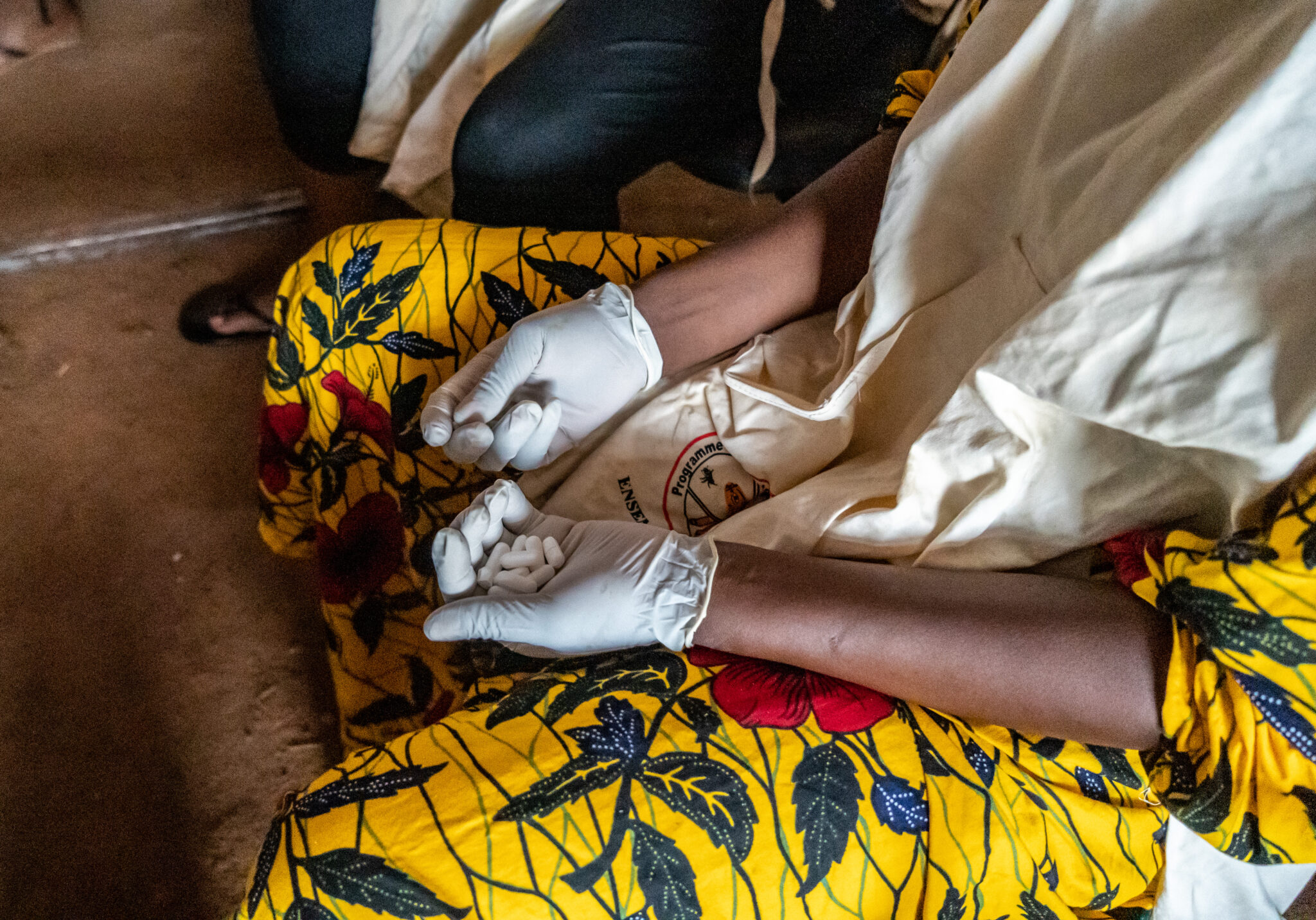 A community health worker in Burkina Faso supporting in community LF treatment.